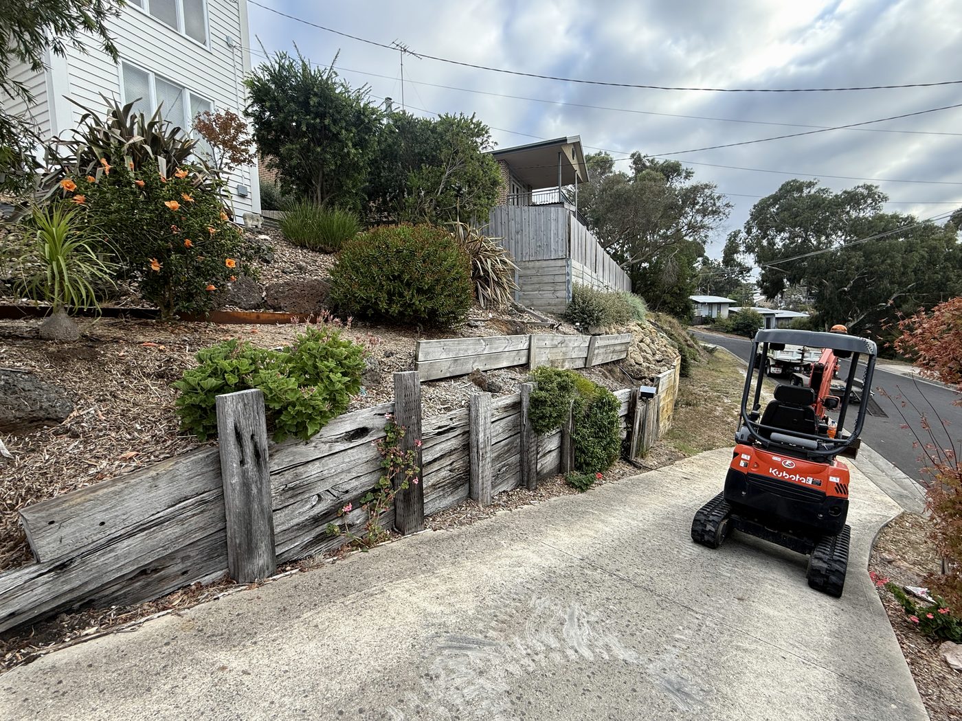 Before — original failing timber retaining wall in Ocean Grove