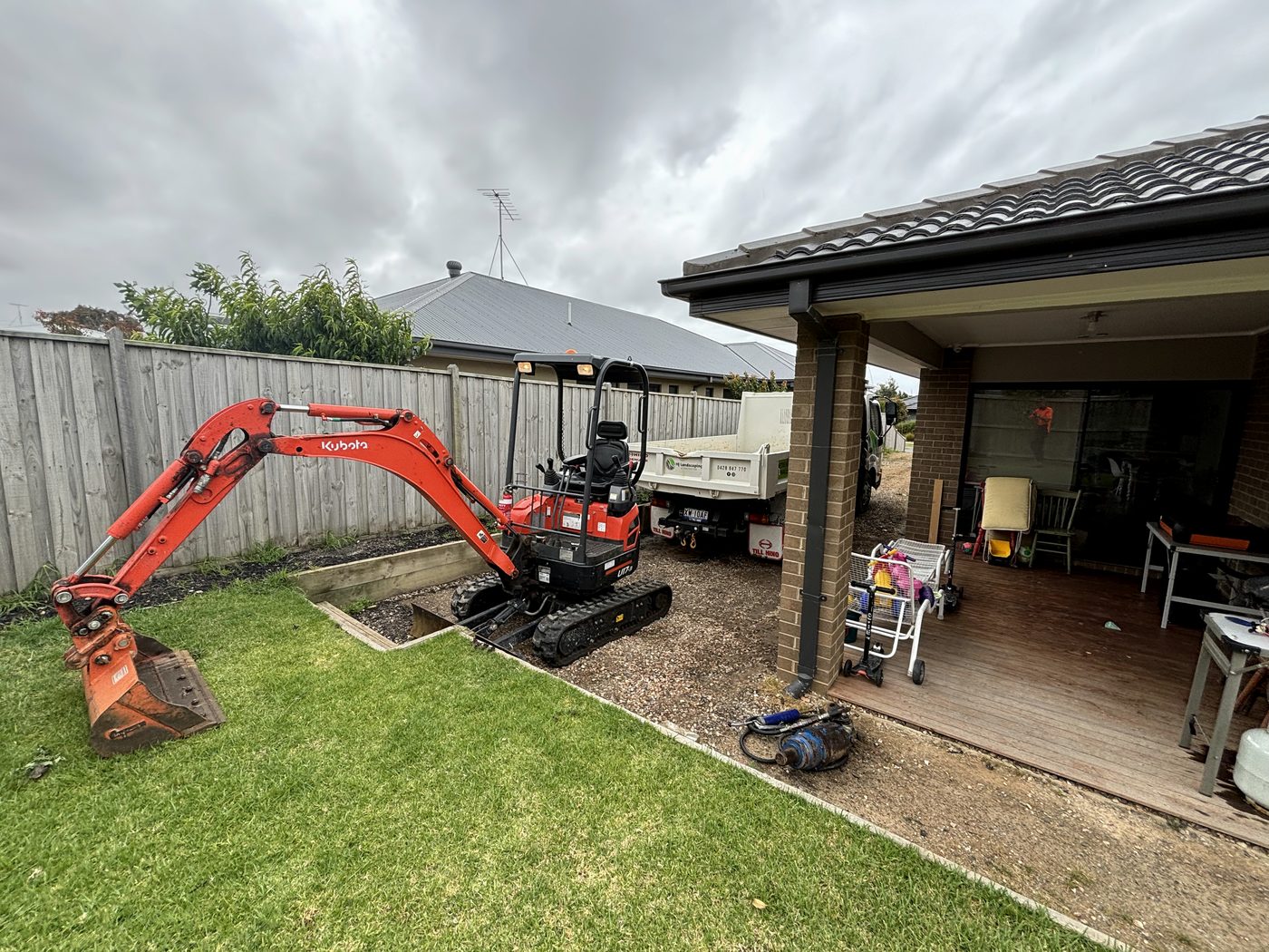 HJ Landscaping excavator on site at a Torquay-area job
